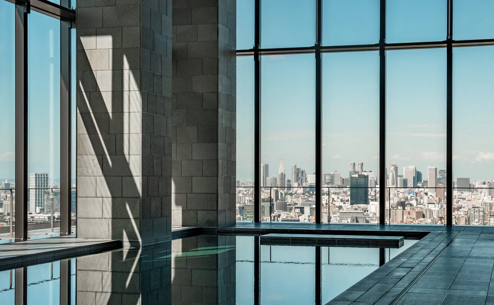 City skyline seen through floor-to-ceiling windows