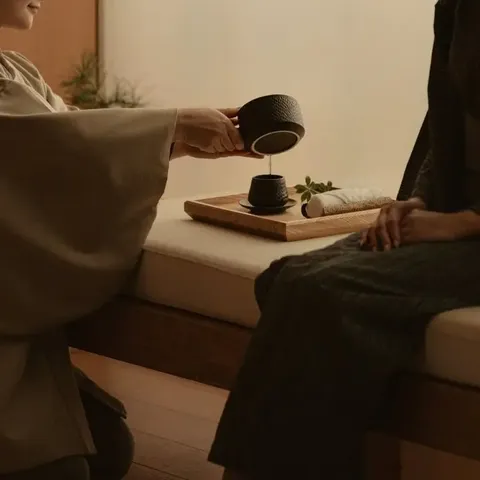 Tea being poured during a hospitality training session